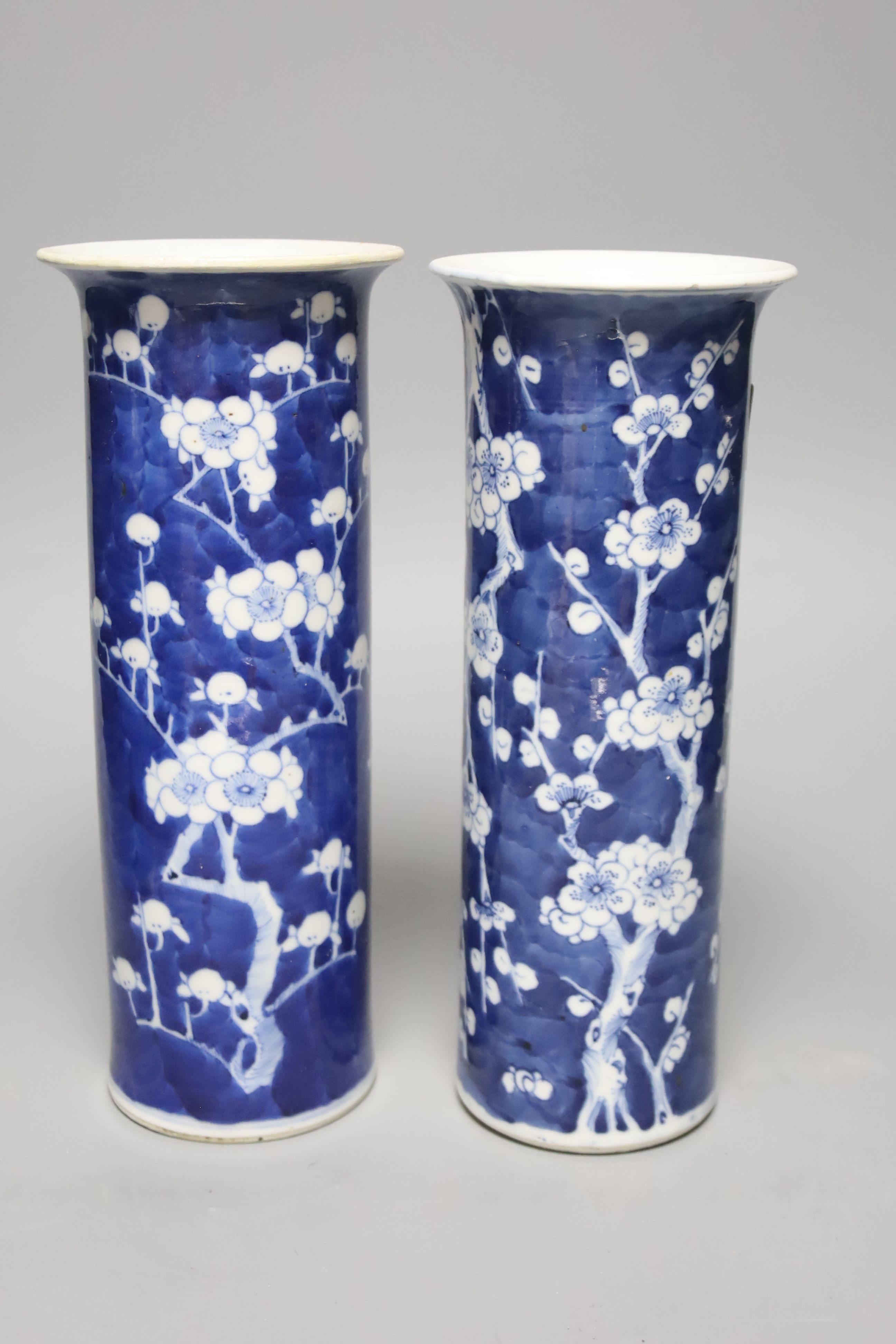 Four Chinese prunus pattern vases and a vase and cover, tallest 26.5cm